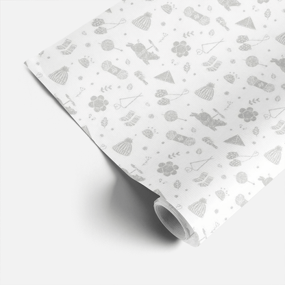 Geschenkpapier mit liebevollen Strick-Motiven